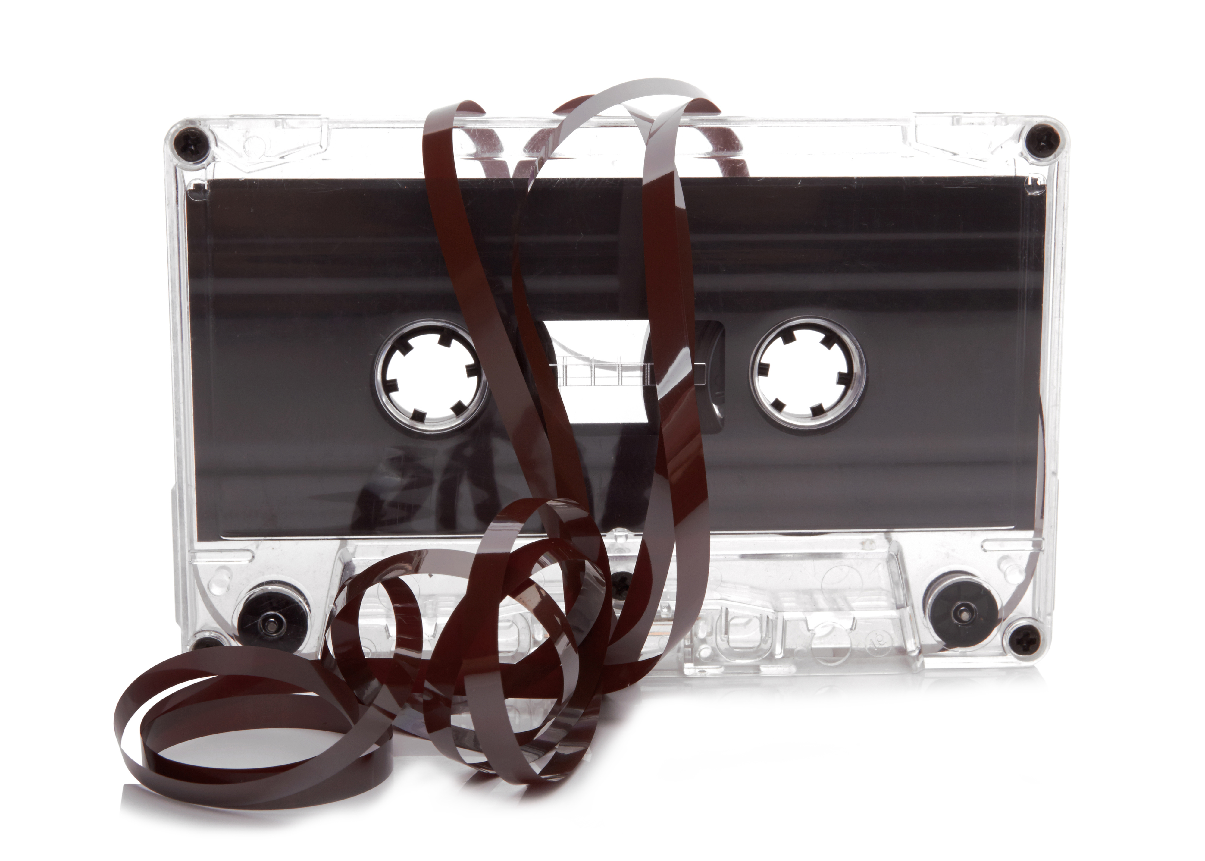 Audio cassette with tape tangle on white background